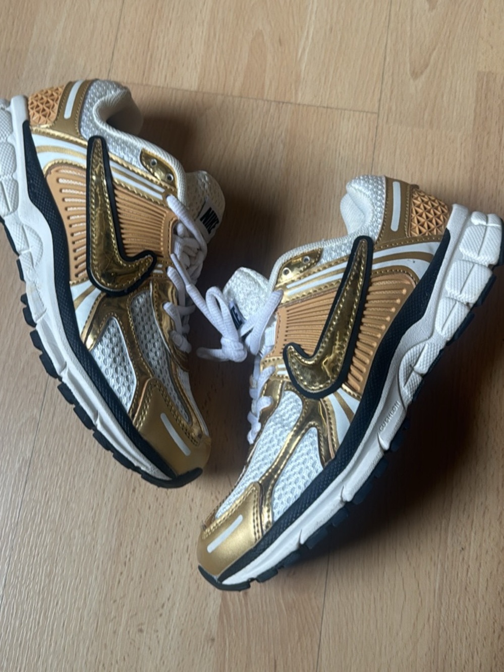 Nike Women’s Gold Vomero Sneakers